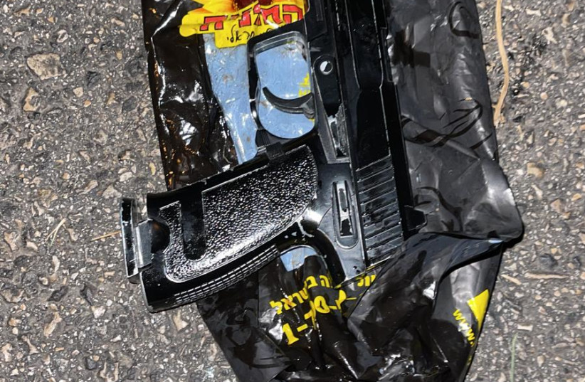 A gun found in the car of two suspects who tried to run over police