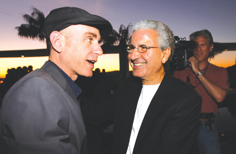   DIRECTOR JOSEPH CEDAR (LEFT) talks with Moshe Edery, one of the producers of the Israeli film ‘Footnote,’ in Beverly Hills. (photo credit: FRED PROUSER/REUTERS)