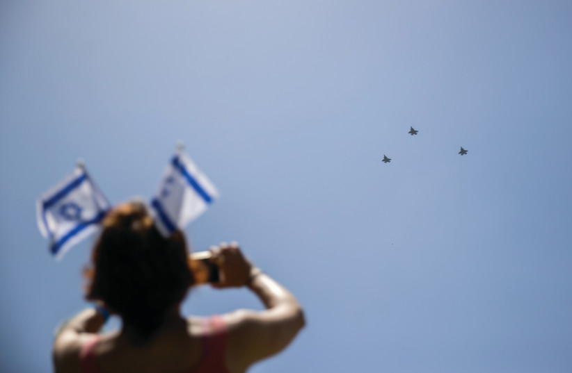  Spectators watch the military air show during Israel’s 73rd Independence Day celebrations in Jerusalem.  (credit: YONATAN SINDEL/FLASH90)