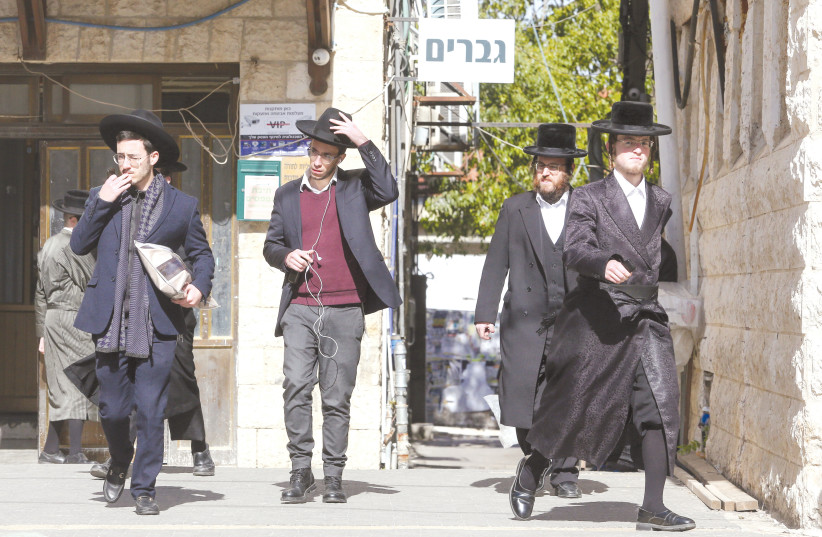 Illustrative photo of young haredi men walking in Jerusalem (credit: MARC ISRAEL SELLEM)