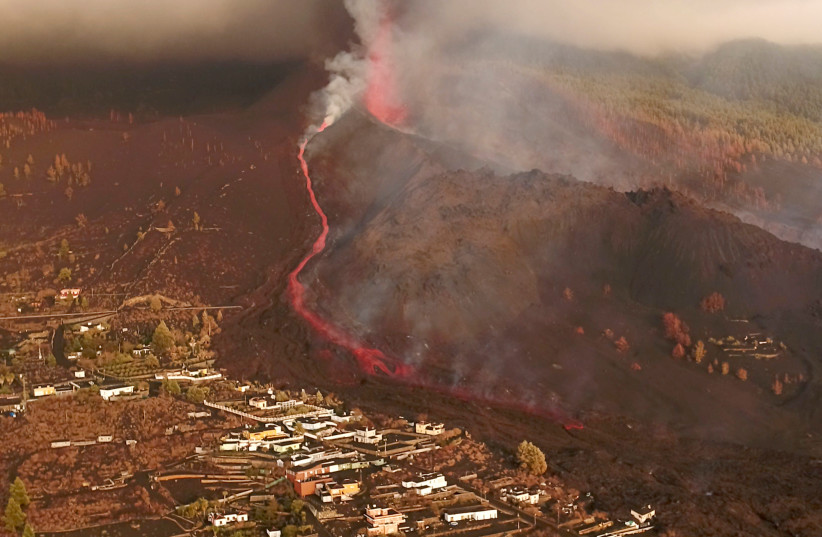  A screengrab from drone footage shows lava flowing following the eruption of a volcano in the Cumbre Vieja park, on the Canary Island of La Palma (photo credit: REUTERS TV)