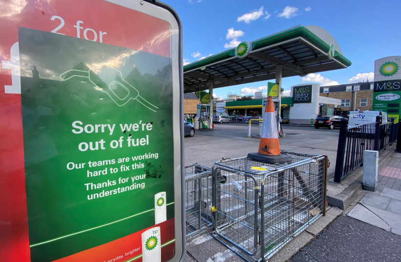  A BP petrol station that has run out of fuel is seen in south London, Britain. (photo credit: TOBY MELVILLE/REUTERS)