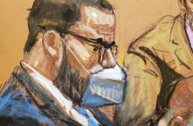  R. Kelly sits with his lawyers as the jury deliberate in Kelly's sex abuse trial at Brooklyn's Federal District Court in a courtroom sketch in New York, US. (photo credit: JANE ROSENBERG/REUTERS)