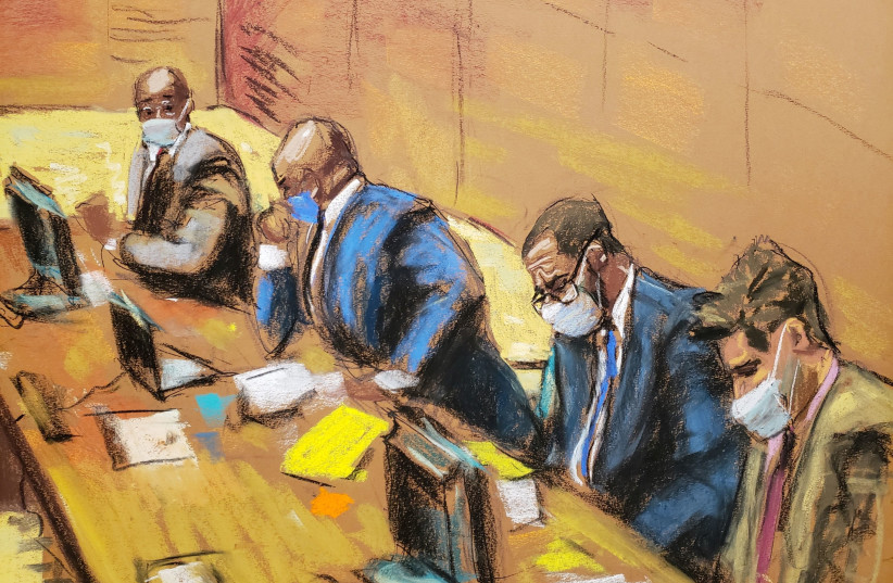 R. Kelly sits with his lawyers Deveraux Cannick, Calvin Scholar and Thomas Farinella as the jury deliberate in Kelly's sex abuse trial at Brooklyn's Federal District Court in a courtroom sketch in New York, US. (credit: JANE ROSENBERG/REUTERS)