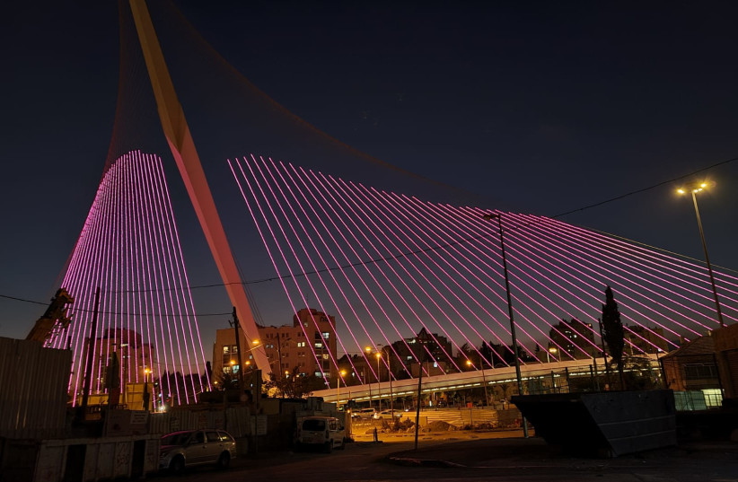 Chords Bridge in Jerusalem lights up pink for breast cancer awareness month. (credit: JERUSALEM MUNICIPALITY)