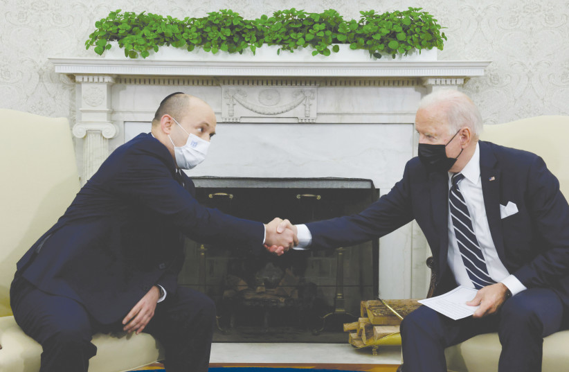  US PRESIDENT Joe Biden and Prime Minister Naftali Bennett shake hands during a meeting at the White House in August. (credit: JONATHAN ERNST / REUTERS)