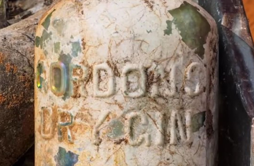 A bottle of Gordon's Dry Gin found a the site of the archeological dig near Ramle (photo credit: IAA)