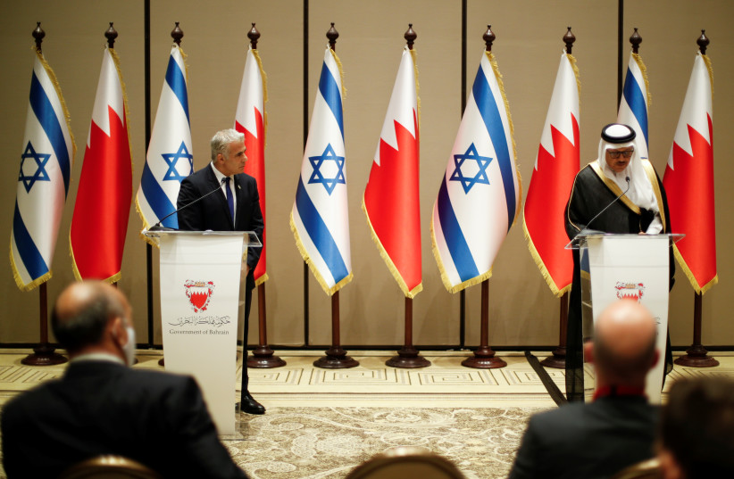  Israeli Foreign Minister Yair Lapid and Bahrain's Foreign Minister Abdullatif Al-Zayani take part in a news conference, Manama, Bahrain, September 30, 2021. (photo credit: REUTERS/HAMAD I MOHAMMED)