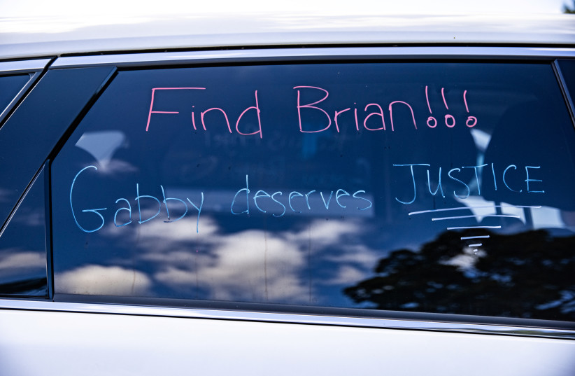  A sign is seen on a car window during Gabby Petito's memorial service in Holbrook, New York, US, September 26, 2021.  (photo credit: REUTERS/JEENAH MOON)