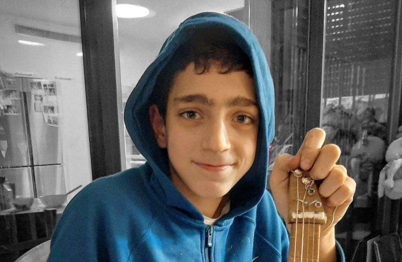  Barak Houri posing with his hand-made guitar. (credit: Courtesy)