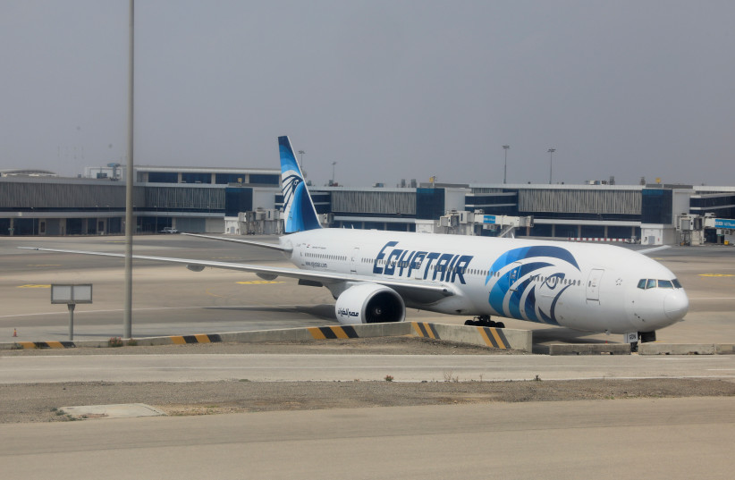  An EgyptAir plane is seen at the airport in Cairo, amid the coronavirus disease (COVID-19) pandemic, Egypt April 9, 2021. (photo credit: REUTERS/AMR ABDALLAH DALSH)