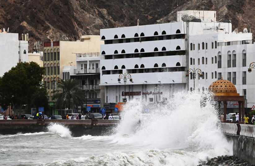 Strong waves hit the shore as Cyclone Shaheen makes landfall in Muscat Oman, October 2, 2021. (photo credit: SULTAN AL HASANI/REUTERS)