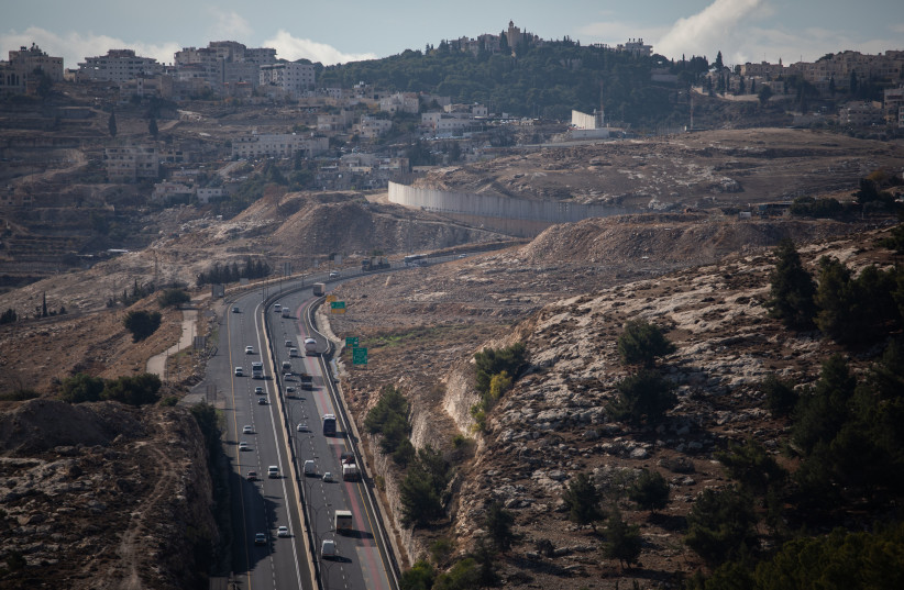  View of Route 1, the Maaleh Adumim-Jerusalem road, from the West Bank area known as E1, with Jerusalem's Mount Scopus seen on the horizon, on December 10, 2019. (photo credit: HADAS PARUSH/FLASH90)