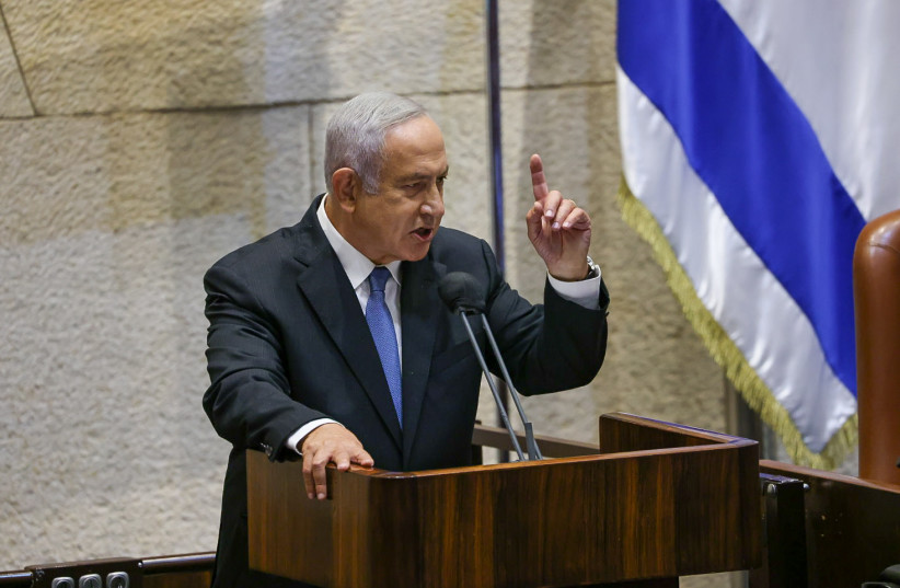 Opposition leader Benjamin Netanyahu speaking in the Knesset plenum on October 4, 2021. (photo credit: NOAM MOSKOVICH)