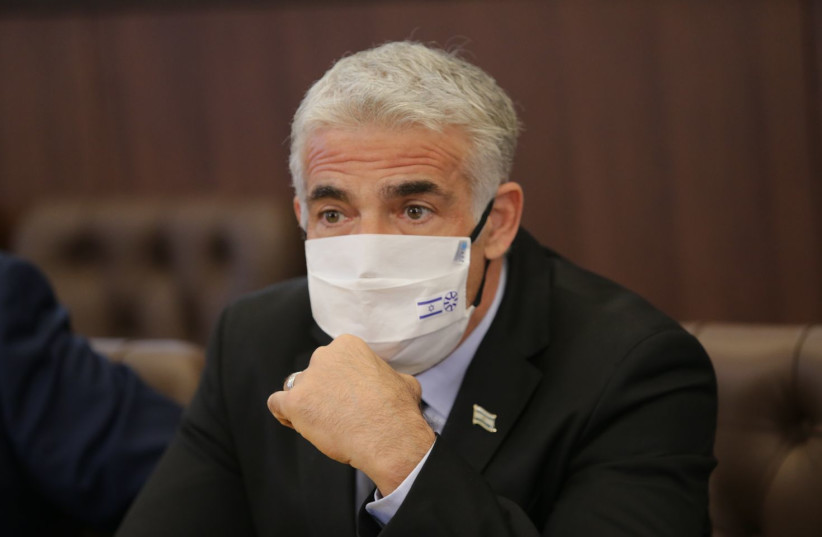  Foreign Minister Yair Lapid at the Knesset, October 5, 2021. (credit: ALEX KOLOMOISKY / POOL)