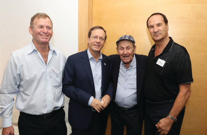  PRESIDENT ISAAC HERZOG and Murray Greenfield, flanked by Ilan Greenfield (left) and Tal Brody. (credit: ITZIK BIRAN)