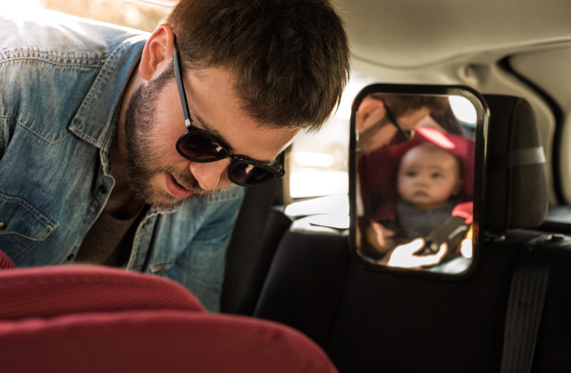  y. Purchase a mirror that can be placed on a baby's car seat to help make drives easier (photo credit: INGIMAGE)
