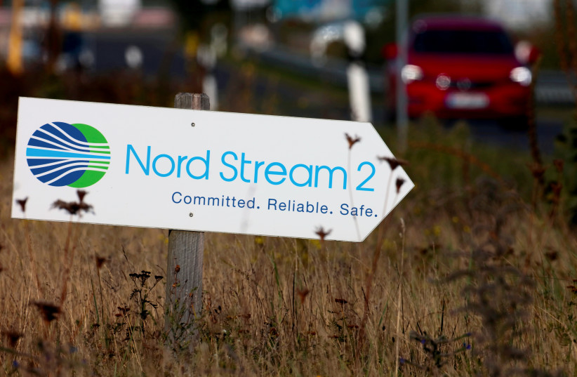  A road sign directs traffic towards the Nord Stream 2 gas line landfall facility entrance in Lubmin, Germany, September 10, 2020. (credit: REUTERS/HANNIBAL HANSCHKE/FILE PHOTO)