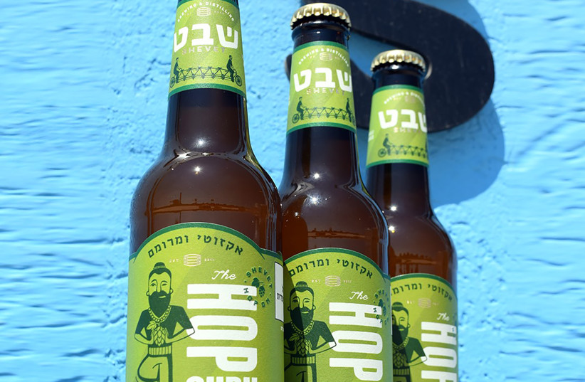 HOP Guru, the new IPA  from the Shevet Brewery in Pardess  Hanna: Strong citrus and pine  flavors. (credit: Courtesy Shevet Brewery)