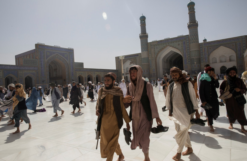  Afghan men walk at a mosque in Herat, Afghanistan September 10, 2021. (credit: VIA REUTERS)