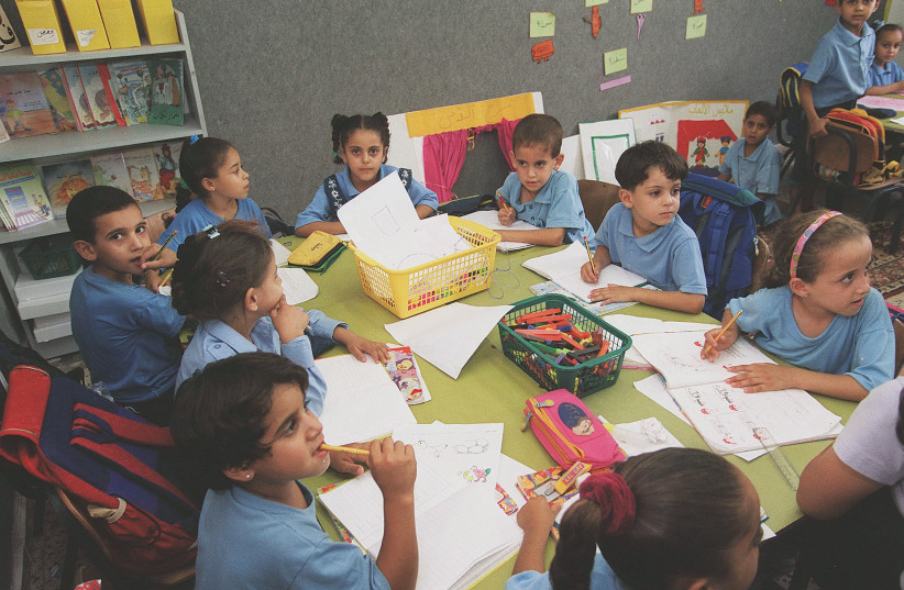  STUDENTS AT an Arab school in the Juarish neighborhood, in Ramle. (photo credit: Moshe Milner/GPO)
