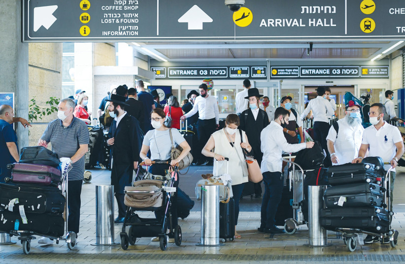  TRAVELERS WALK through Ben-Gurion Airport earlier this year.  (credit: AVSHALOM SASSONI/FLASH90)