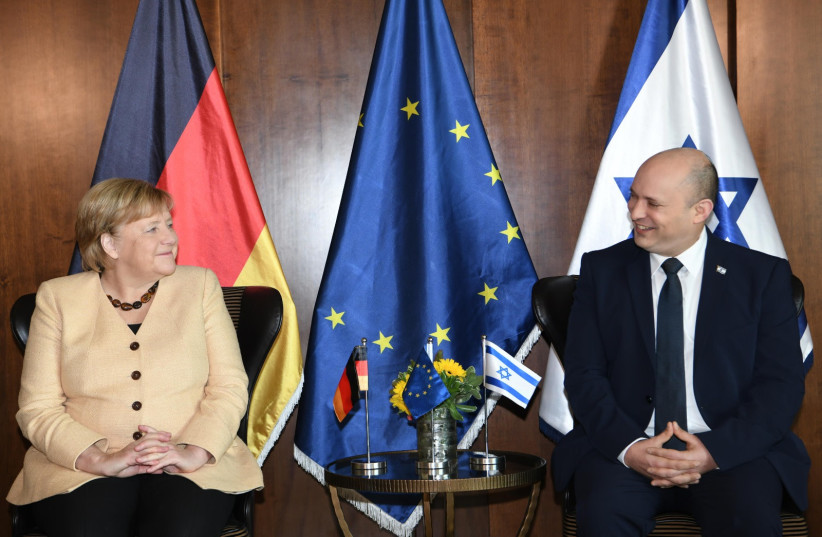  Angela Merkel and Naftali Bennett during the former's visit to Israel on October 10, 2021. (credit: AMOS BEN-GERSHOM/GPO)