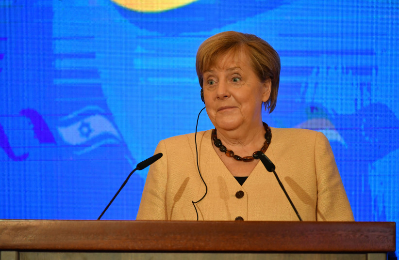  Israeli Prime Minister Naftali Bennett and outgoing German Chancellor Angela Merkel in Jerusalem, October 10, 2021. (credit: YOAV DAVIDKOVITZ / POOL)