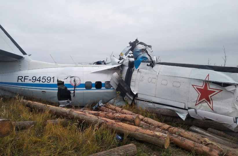  The wreckage of the L-410 plane is seen at the crash site near the town of Menzelinsk in the Republic of Tatarstan, Russia October 10, 2021. (credit: VIA REUTERS)
