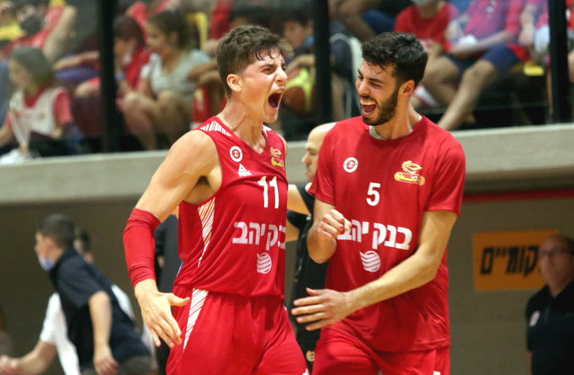  HAPOEL JERUSALEM guard Adam Ariel (left) reacts after one of his five three-pointers, which contributed to his 17 points in the Reds’ 83-69 victory over Hapoel Galil Elyon. (photo credit: LILACH WEISS)