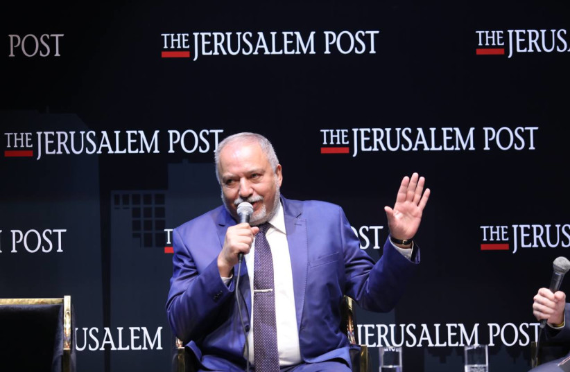  Israel's Finance Minister Avigdor Liberman is seen speaking at the Jerusalem Post annual conference at the Museum of Tolerance in Jerusalem, on October 12, 2021. (photo credit: MARC ISRAEL SELLEM/THE JERUSALEM POST)