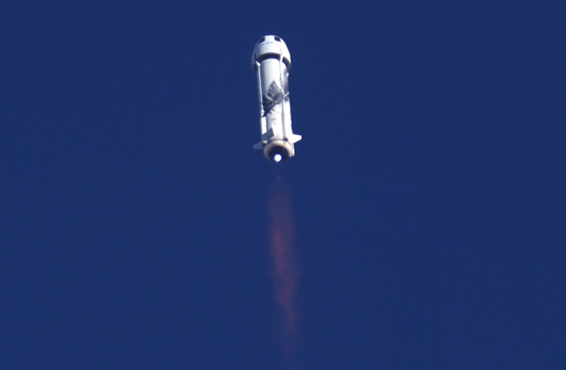  Blue Origin's rocket New Shepard blasts off carrying Star Trek actor William Shatner, 90, on billionaire Jeff Bezos's company's second suborbital tourism flight as part of a four-person crew near Van Horn, Texas, US, October 13, 2021. (credit: MIKE BLAKE/REUTERS)