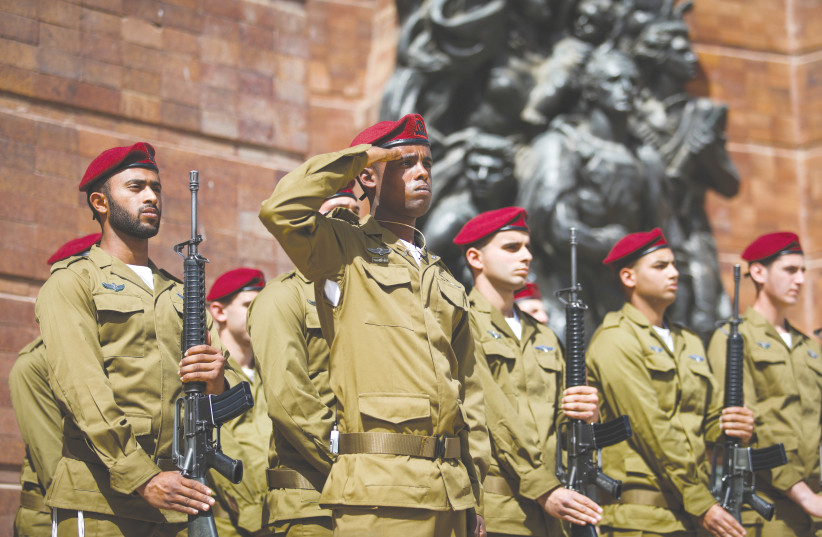 SOLDIERS MARK Holocaust Remembrance Day in April at a ceremony at the Yad Vashem Holocaust Memorial Museum in Jerusalem. (photo credit: OREN BEN HAKOON/POOL)