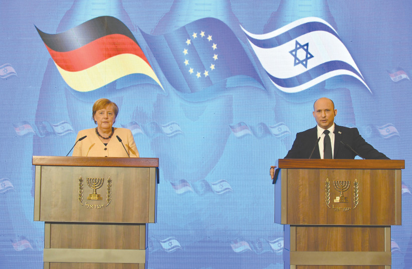  PRIME MINISTER Naftali Bennett and German Chancellor Angela Merkel hold a joint news conference at the King David Hotel in Jerusalem on Sunday. (photo credit: Yoav Dudkevitch/Pool)