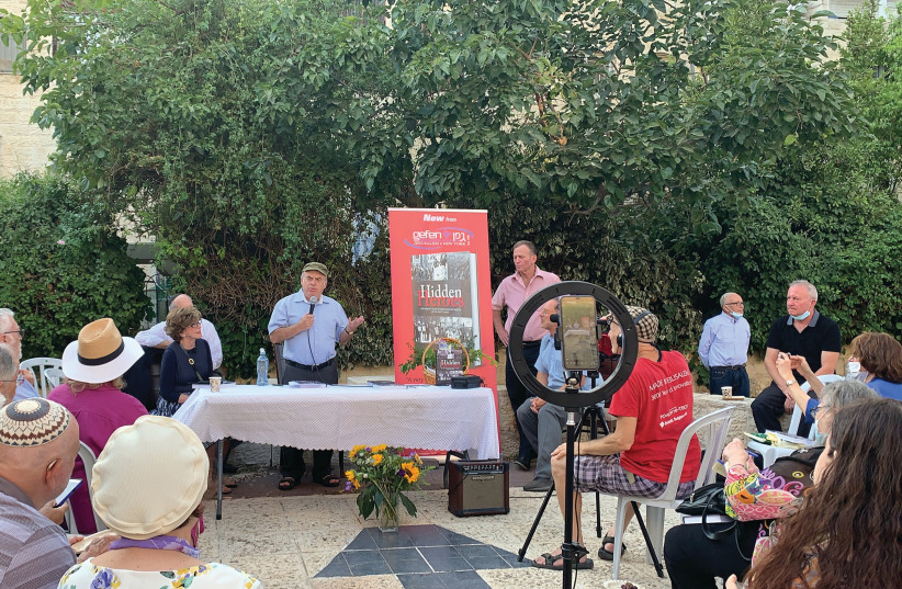  Natan Sharansky addresses the book launch of ‘Hidden Heroes’ in Jerusalem on August 31 as author Pamela Braun Cohen looks on. (photo credit: HALLEL SILVERMAN)