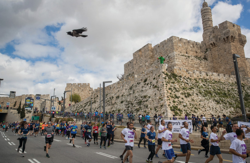  THOUSANDS OF runners take part in the 2019 Jerusalem Marathon.  (photo credit: YONATAN SINDEL/FLASH90)