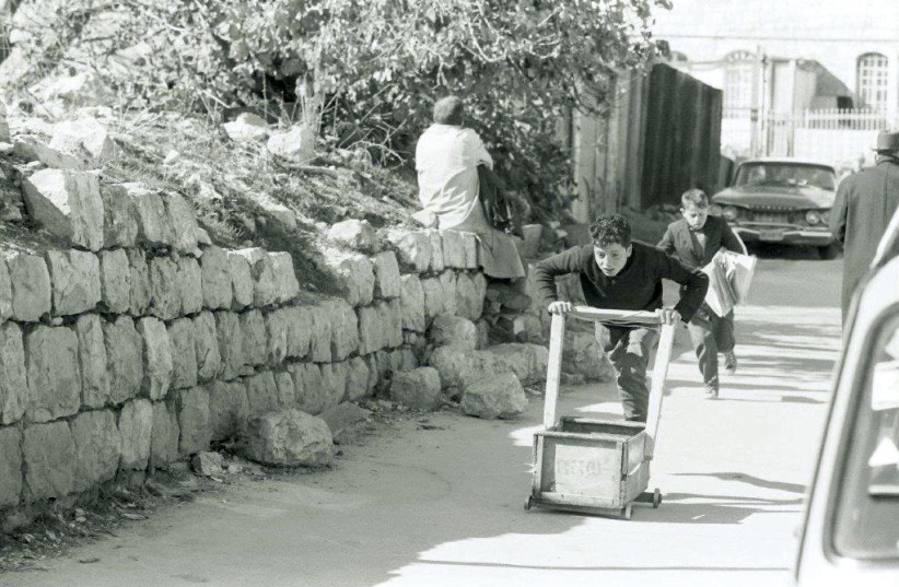  CHILDREN SELL newspapers on Agrippas Street in 1973.  (credit:  AVIV ITZHAKY)