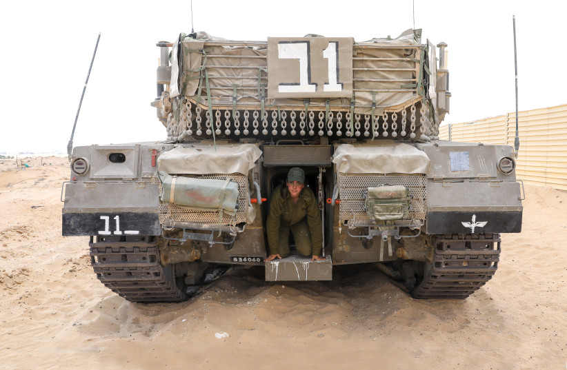  CPL. NOAM HEN peeks out from the tank she drives. (credit: MARC ISRAEL SELLEM)