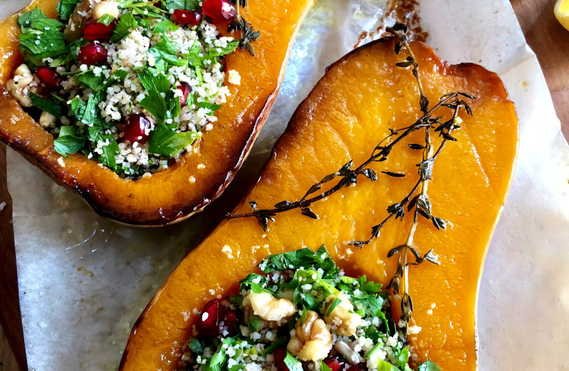   Butternut squash stuffed with herbs, couscous and pomegranate seeds. (credit: PASCALE PEREZ-RUBIN)
