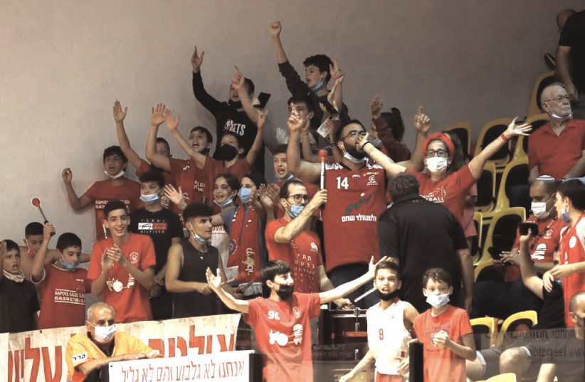  HAPOEL GALIL ELYON is back in the top tier of Israeli hoops for the first time in 13 years and the club’s chairman, Tamir Abrahams (inset, top left), notes that the enthusiasm throughout the region is being expressed by fans of all ages.  (credit: LILACH WEISS)