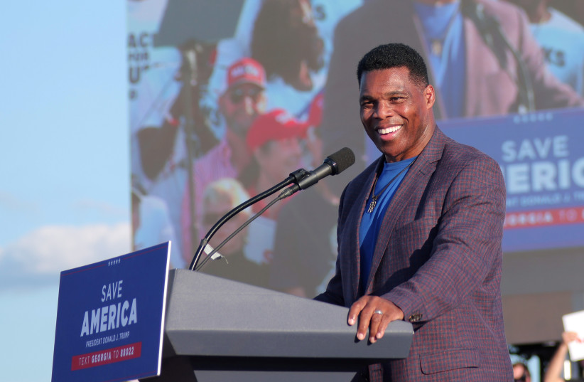  Former college football star and current senatorial candidate Herschel Walker speaks at a rally in Perry, Georgia, US. (photo credit: REUTERS/DUSTIN CHAMBERS)