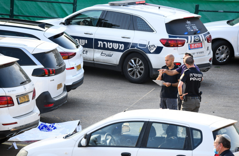  Police at the scene where real estate developer Eldad Peri was shot in a drive-by shooting in Rehovot, October 15, 2021.  (photo credit: FLASH90)