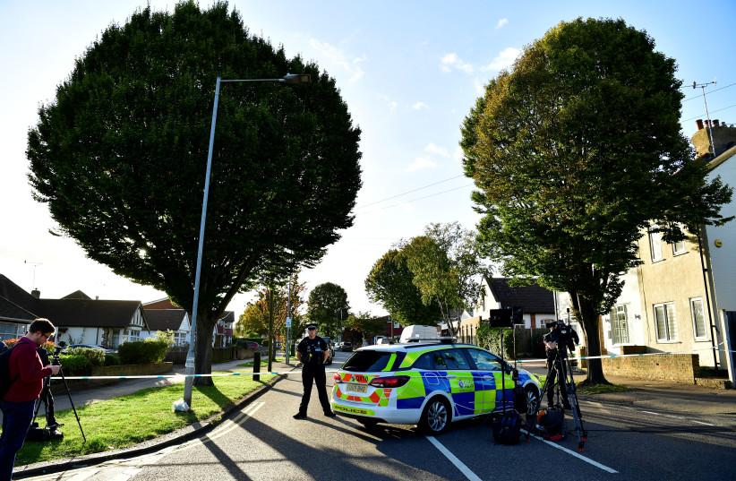  A police officer guards the scene where MP David Amess was stabbed during constituency surgery, in Leigh-on-Sea, Britain October 15, 2021. (photo credit: REUTERS/TONY O'BRIEN)