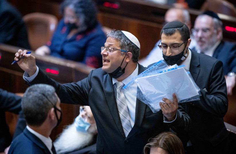  MK Itamar Ben Gvir is taken out during a plenum session in the assembly hall of the parliament (Knesset) on October 11, 2021.  (credit: YONATAN SINDEL/FLASH90)