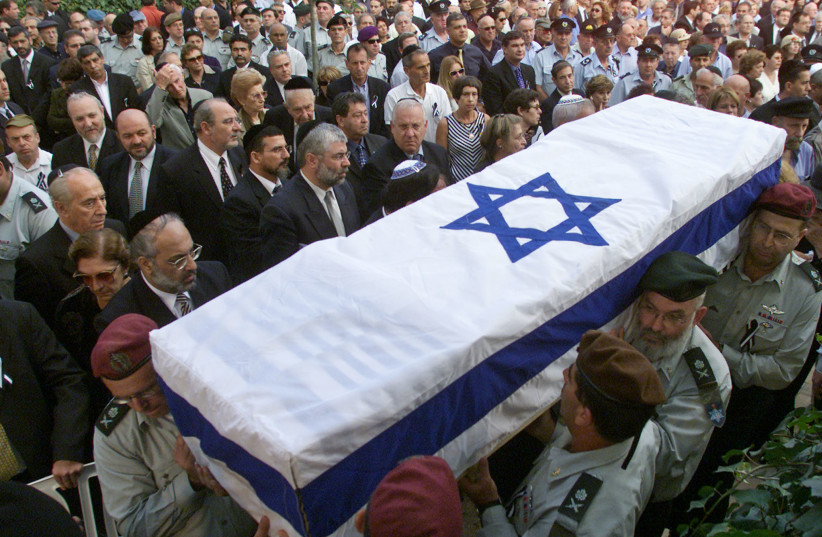 The coffin of slain Israeli cabinet minister Rehavam Zeevi arrives at Mt. Herzel military cemetery in Jerusalem October 18, 2001. (credit: REUTERS/Natalie Behring NB/CRB)