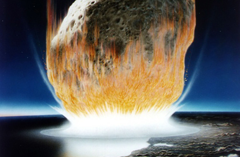 An asteroid is shown in an artist's rendition crashing into Earth in an event that scientists believe occurred in the Caribbean region at the boundary of the Cretaceous and Tertiary periods in Earth's geologic history about 65 million years ago causing the extinction of dinosaurs.  (credit: REUTERS)