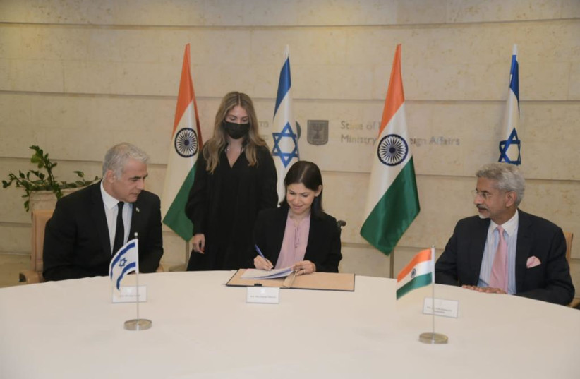 Israeli Foreign Minister Yair Lapid (far left) meets with Indian Minister of External Affairs Dr. Subrahmanyam Jaishankar (far right). October 18, 2021. (photo credit: AVI HAYUN/FOREIGN MINISTRY)