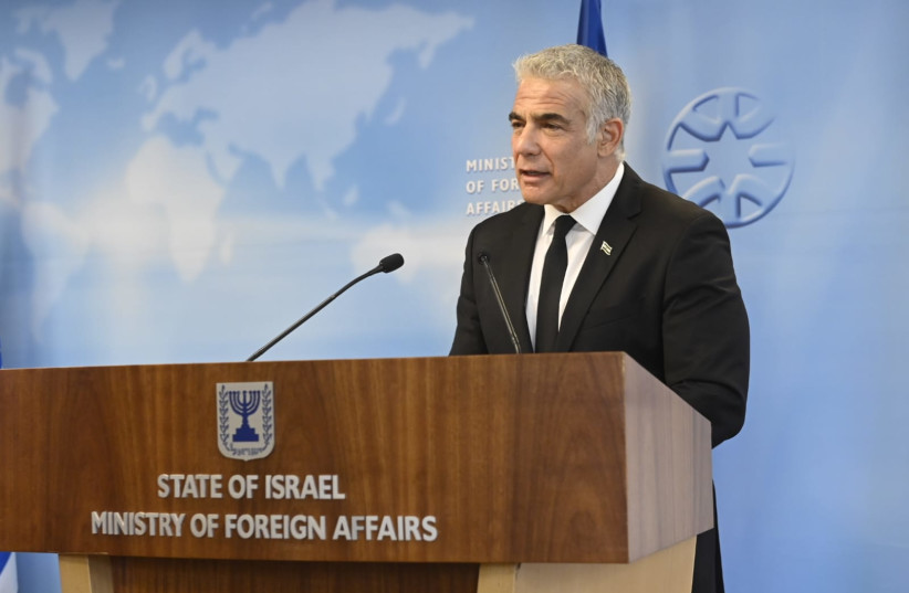 Foreign Minister Yair Lapid (R). October 18, 2021. (credit: JORGE NOVOMINSKI)