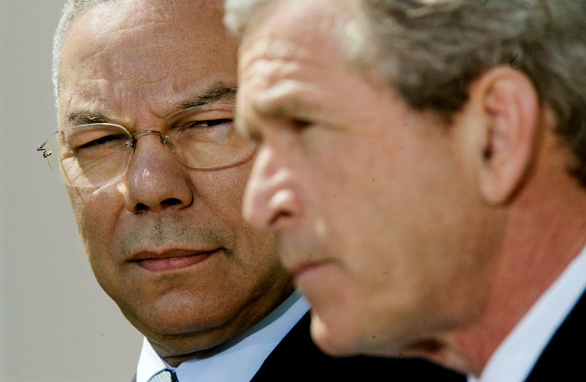  US President George W. Bush speaks about the Middle East from the Rose Garden of the White House as US Secretary of State Colin Powell (L) stands at his side April 4, 2002.  (credit: REUTERS/KEVIN LAMARQUE)