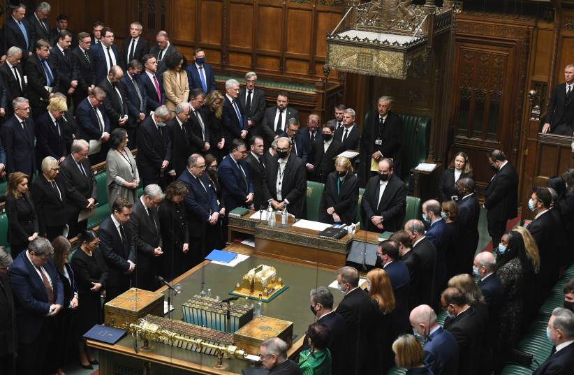  Members of Parliament pay tribute to murdered MP David Amess with a minute's silence in the House of Commons in London, Britain October 18, 2021. (credit: VIA REUTERS)